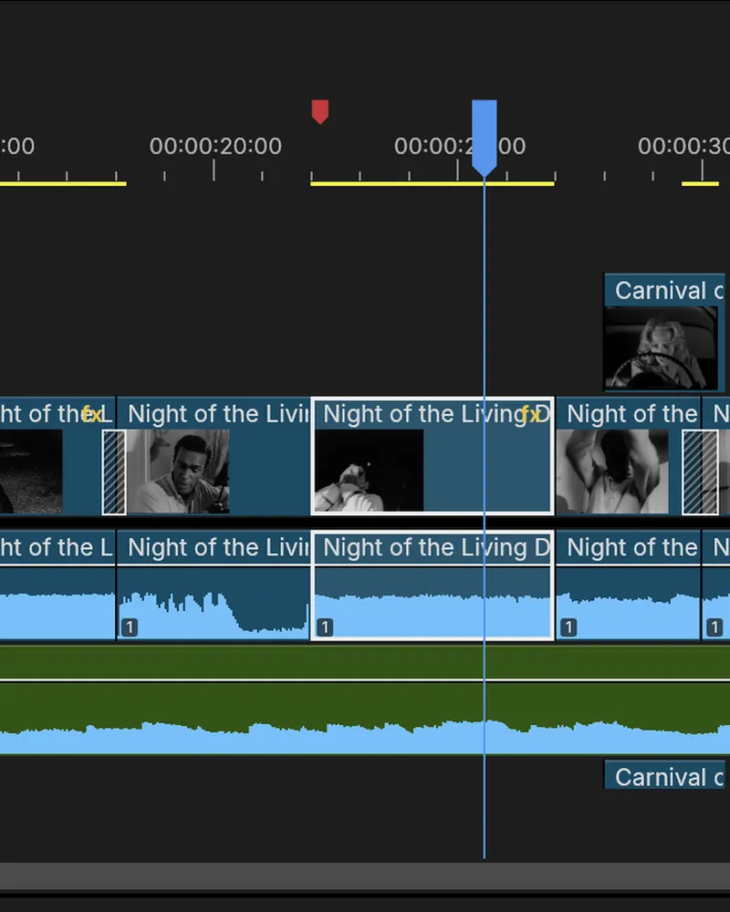 A close-up of FilmCraft's timeline: clips with dissolves on V1, an insert on V2, the score as a waveform